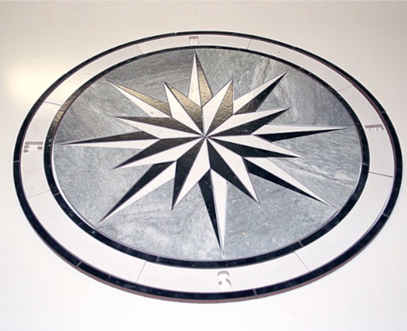 A compass cut from stone